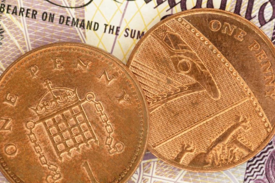 British Pennies on a Pound Note